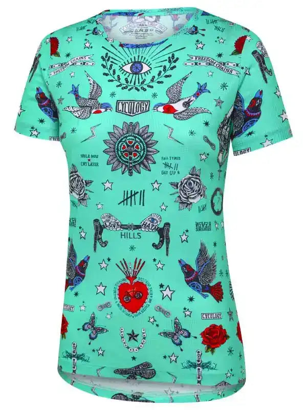 Women's mint green cycling jersey with tattoo-style birds, roses, stars, and eye design