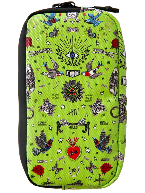 A bright lime green zippered cycling wallet featuring a detailed tattoo-style print with birds, roses, stars, and a central eye motif, shown against a plain white background.