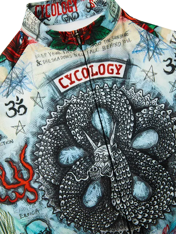 Close-up of a long sleeve cycling jersey  with a prominent snake design and 'Cycology' branding.
