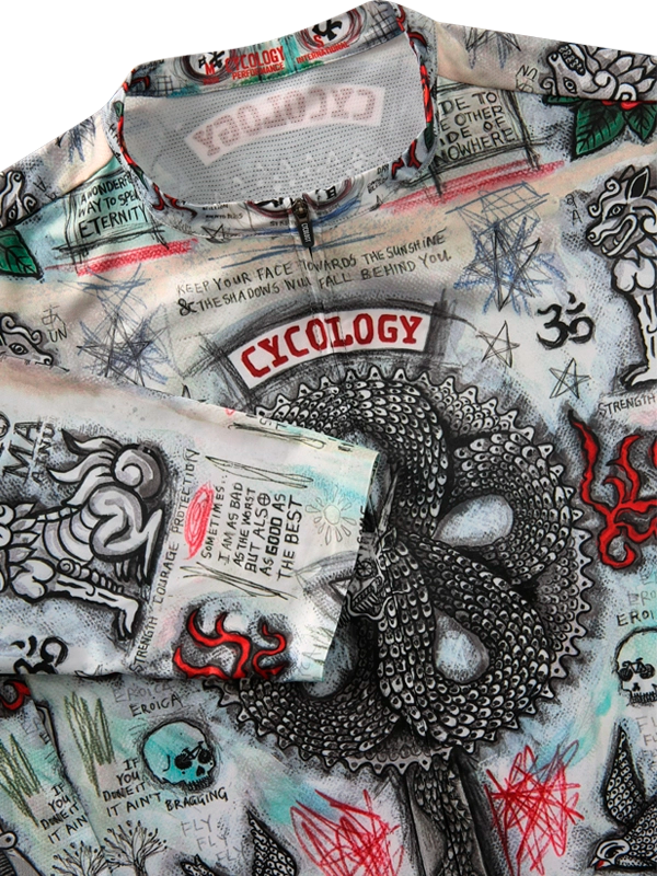 Close-up of a cycling jersey with intricate designs and text, including 'Cycology'.