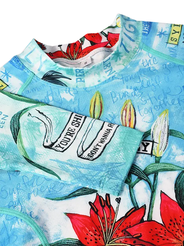 Aqua Blue long sleeve cycling base layer with floral design and text 