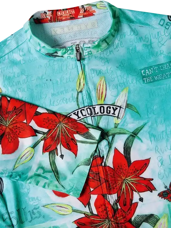 Cycling jersey with red lily print and 'CYCOLOGY' branding, ideal for men's and women's rides