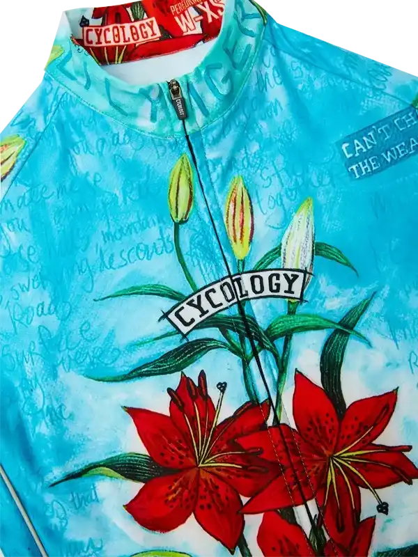 Blue cycling jersey with red lily print, 'CYCOLOGY' logo, and script design for men's or women's bike wear