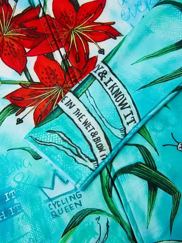 Vibrant red lilies & teal cycling apparel with 'Cycling Queen' print, unique design for women riders