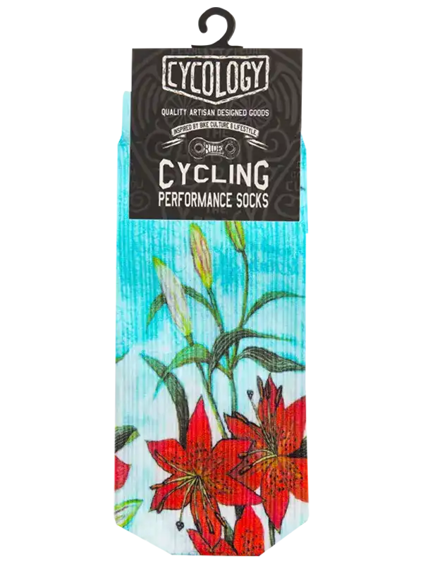Cycling performance socks with red lily floral design on turquoise background, artisan crafted for bike culture