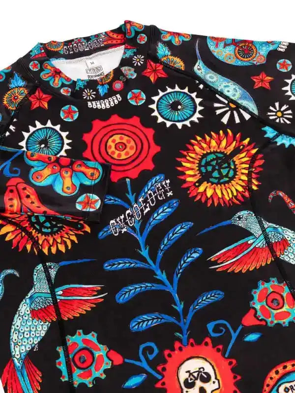 Vibrant cycling jersey with floral, hummingbird, and gear print on black fabric for men and women