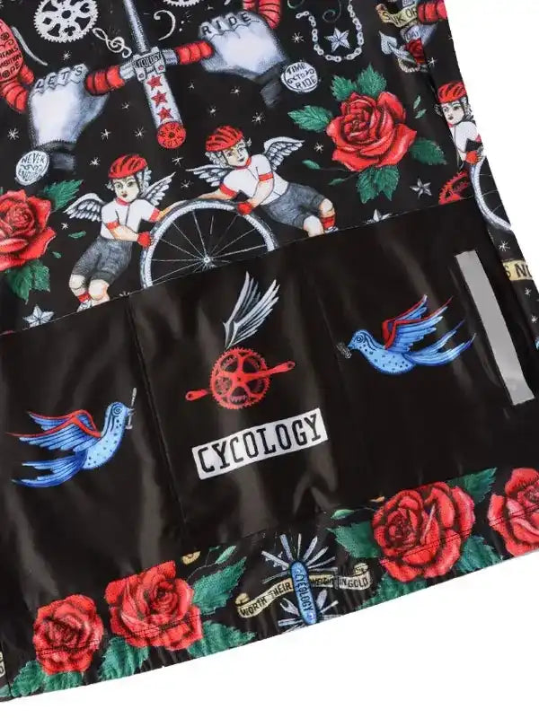 Cycology cycling shorts with tattoo-style roses, angels, and birds on black fabric