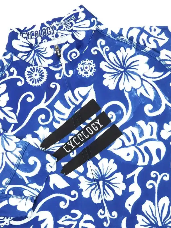 Blue and white floral cycling jersey with Cycology branding, featuring performance fabric and bold tropical print design.