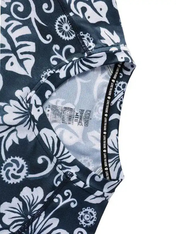 Black and white floral cycling jersey with performance fabric and gear print details