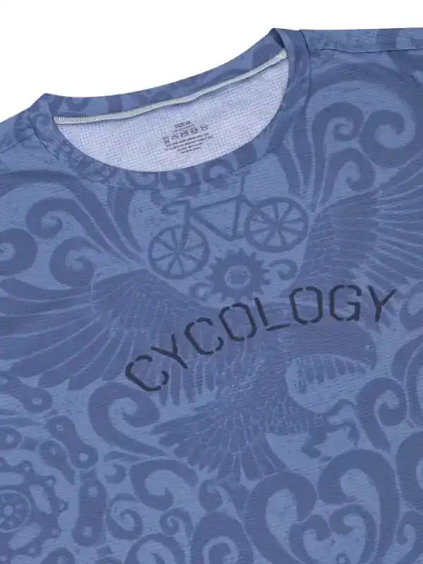 Blue cycling jersey with 'CYCOLOGY' text and bike wing design, featuring unique patterned fabric for men's and women's rides.