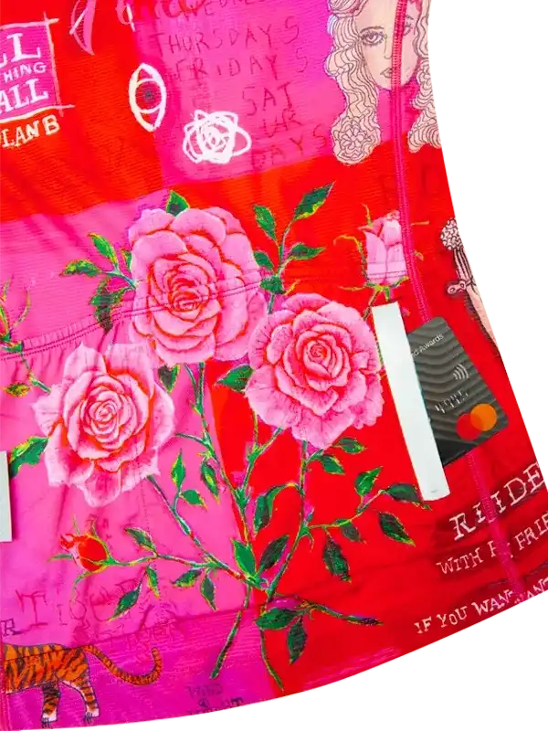 Vibrant pink and red cycling jersey with floral rose design and bold graphics