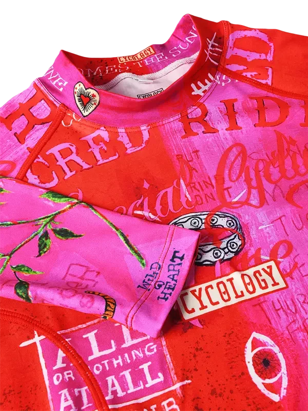 Vibrant pink and red cycling jersey with bold graphics and 'Cycology' branding, ideal for road rides.