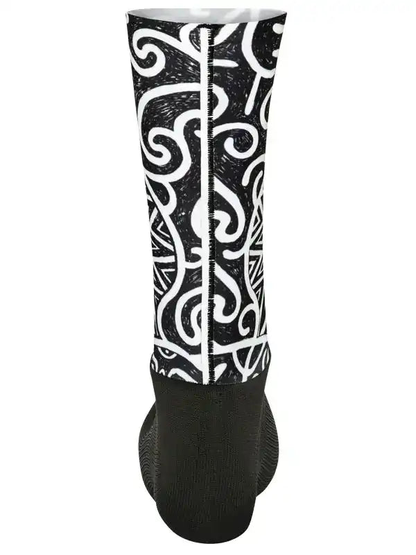 Black and white patterned cycling arm warmer with bold swirl design for men and women