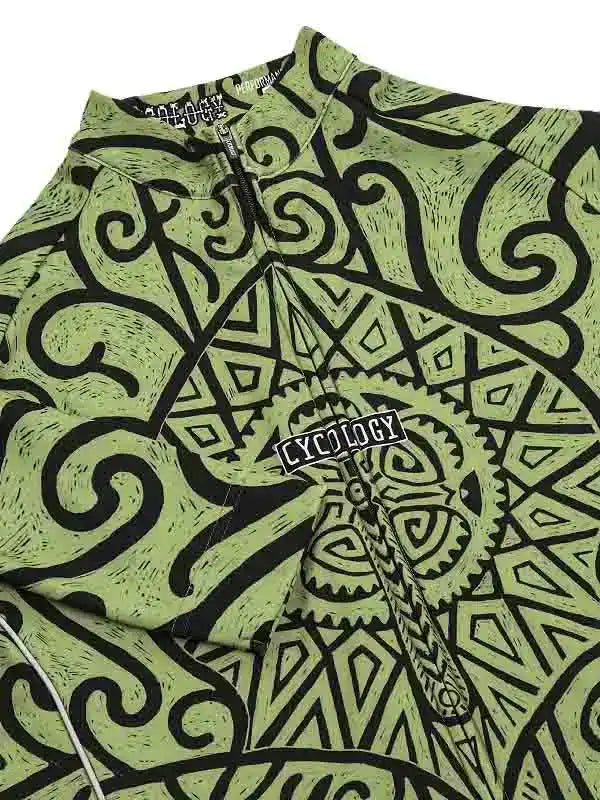 Green cycling jersey with black tribal and gear pattern, featuring 'CYCOLOGY' logo on chest