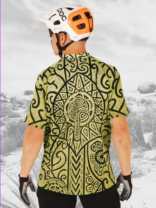 Men's cycling jersey with Maori-inspired pattern, worn with helmet and gloves for mountain biking