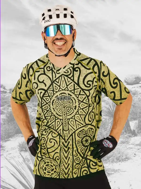 Man in bold patterned cycling jersey, helmet, and sunglasses, ready for a ride.