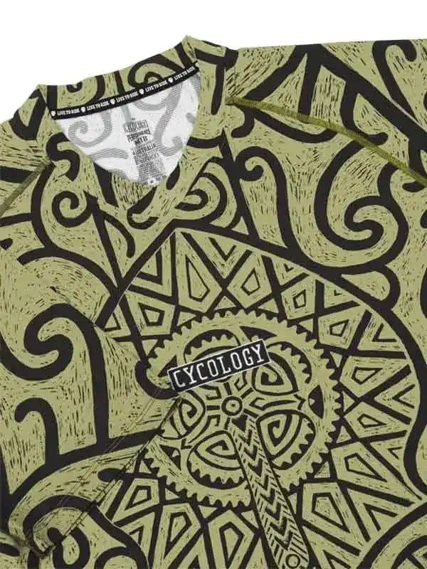 Men's cycling jersey with bold black tribal and gear pattern on olive green, featuring 'CYCOLOGY' logo