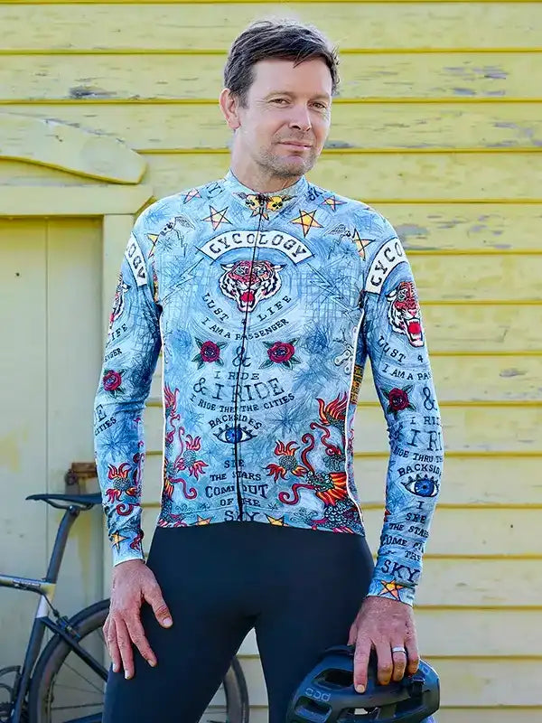 Men's long sleeve cycling jersey with tiger and tattoo-style graphics, paired with black bib tights