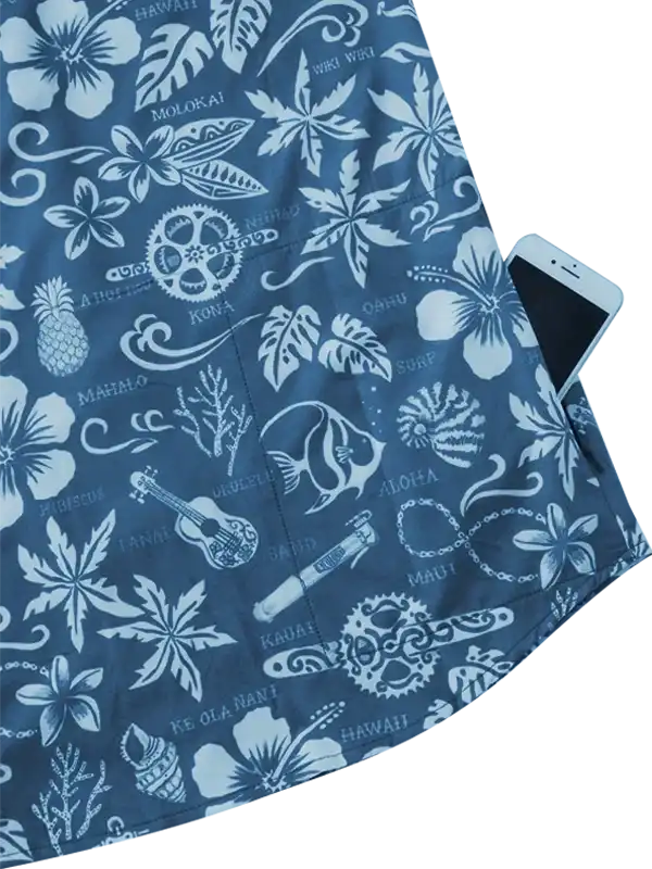 Blue Hawaiian print cycling shorts with floral, pineapple, and surf designs, featuring side pocket holding phone