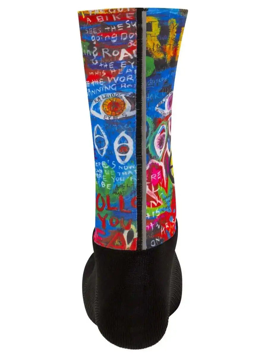 Colorful cycling sock with graffiti art, eyes, and bold text, featuring black cuff and heel for men's or women's bike rides