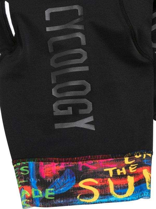 Black cycling jersey with 'CYCOLOGY' text and colorful graffiti-style hem design