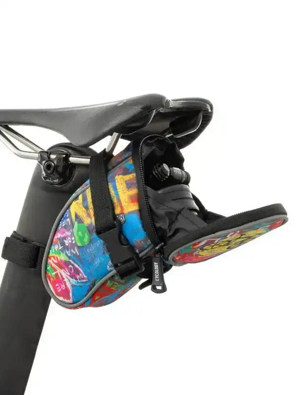 Colorful graffiti-style cycling saddle bag with water bottle holder, attached to bike seat
