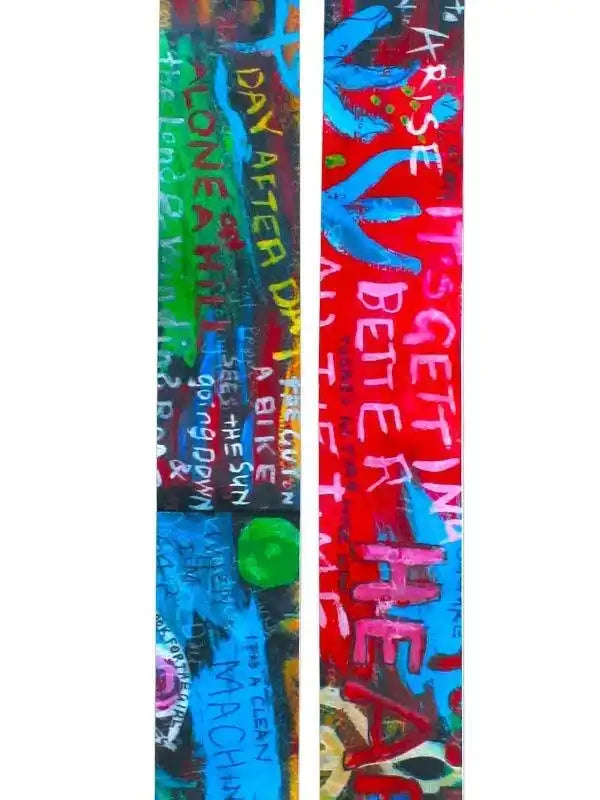 Vibrant cycling jersey with bold graffiti-style text and colorful abstract art design