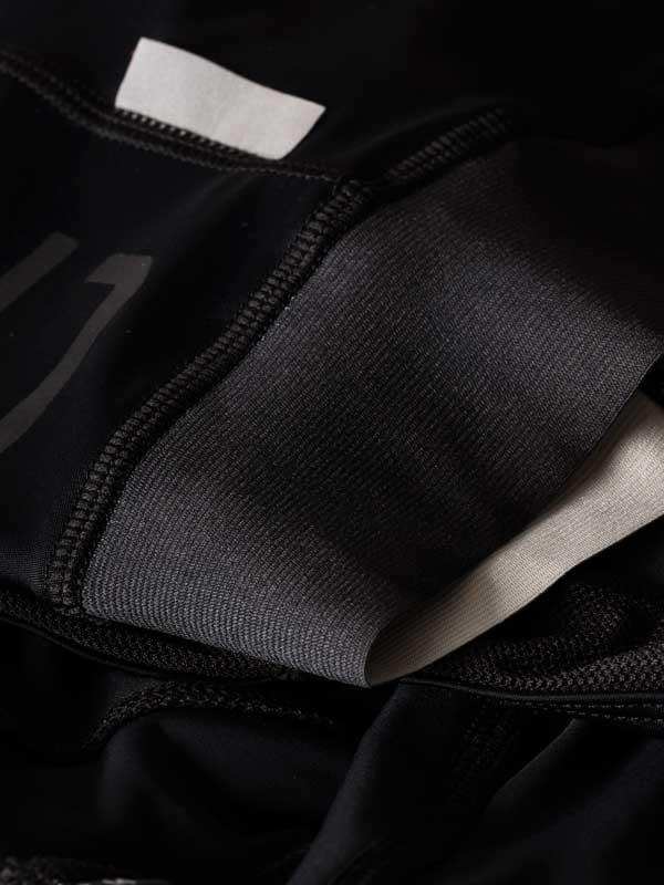 Black cycling shorts with padded chamois and breathable fabric detail