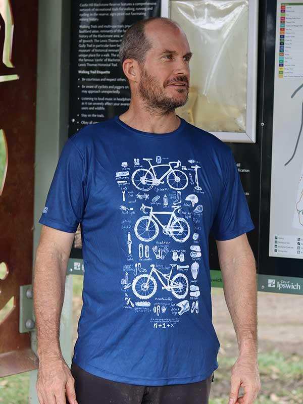 Man wearing blue cycling t-shirt with bike graphics, ideal for men's cycling apparel