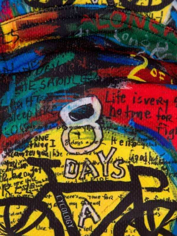Vibrant cycling jersey with bold '8 DAYS A WEEK' graphic, graffiti-style text, and colorful abstract design.
