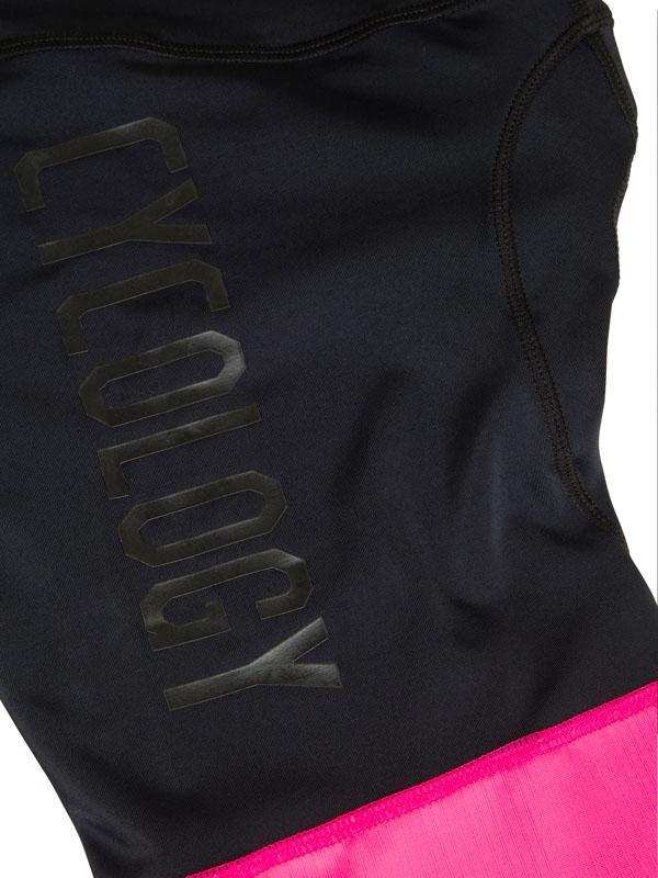 Black cycling shorts with pink hem and Cycology logo, performance fabric for men's and women's rides