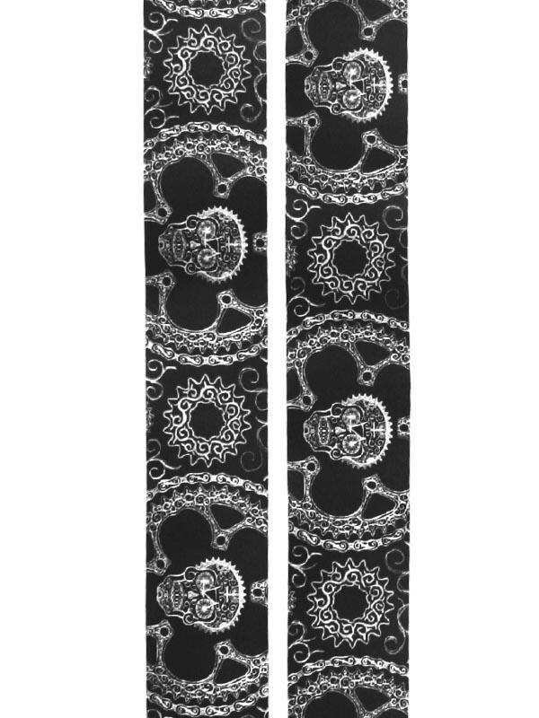 Black cycling socks with white skull and gear pattern, stylish bike apparel for men and women