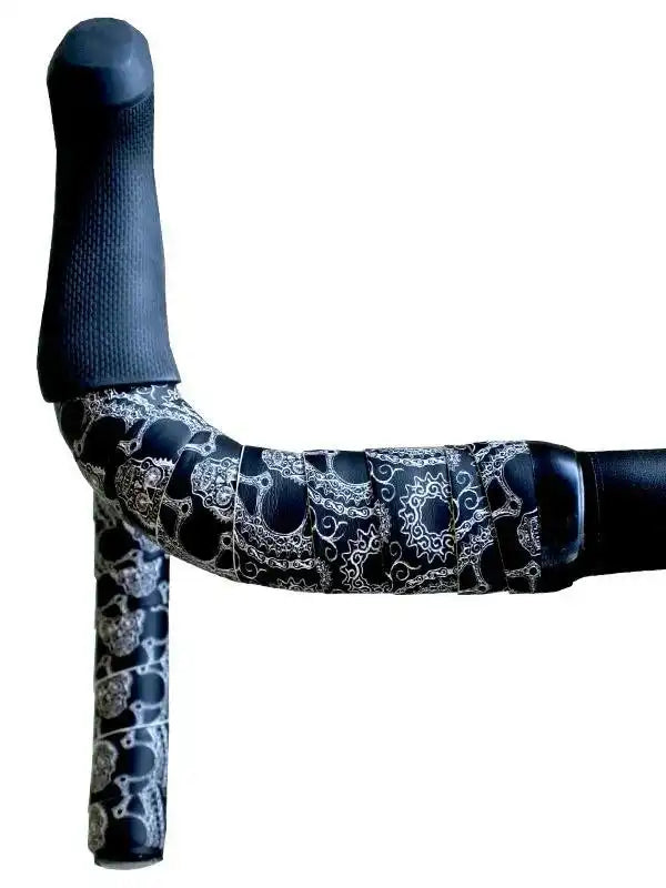 Black bike handlebar wrap with white gear and skull pattern, ergonomic grip for cycling comfort