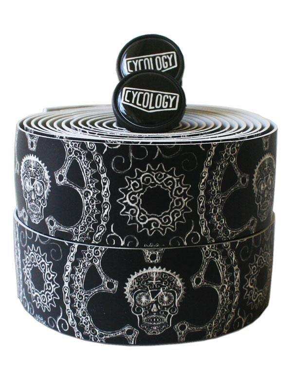 Black and white skull-patterned bike handlebar tape with Cycology end plugs