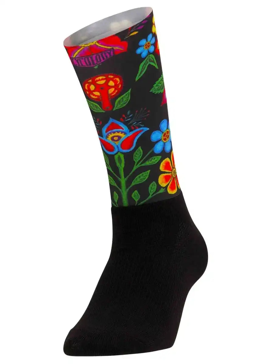 Colorful floral and mushroom pattern cycling sock with black base, vibrant design for bike rides
