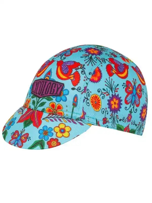 Colorful floral cycling cap with vibrant butterfly and flower print on light blue fabric