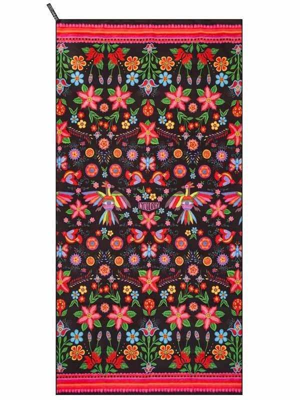 Vibrant floral and bird patterned cycling towel with bold colors and intricate designs