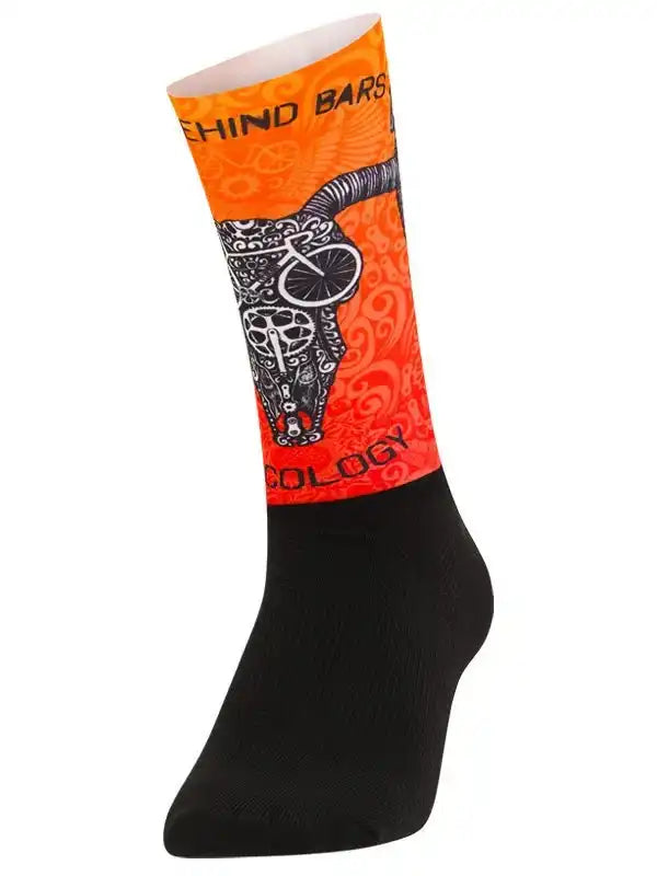 Orange cycling sock with bull skull and bike graphic, black toe and heel, 'Behind Bars' text