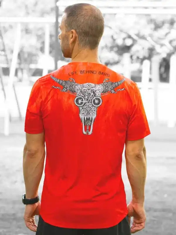 Men's red cycling jersey with skull and bike graphic, 'Life Behind Bars' text, outdoor wear