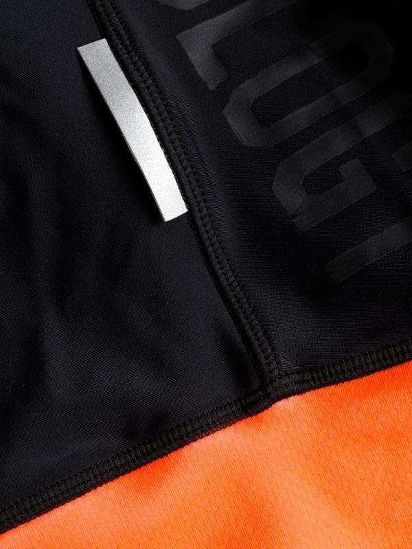 Black and orange cycling jersey with reflective strip and bold graphic design