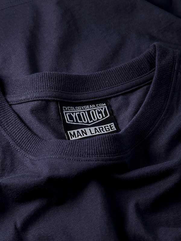 Cycology men's large cycling t-shirt tag, navy blue fabric, brand label detail