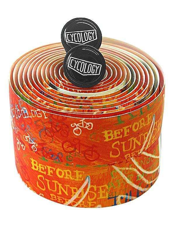 Cycology cycling handlebar tape with 'Before Sunrise' print, vibrant orange design, bike graphics, and branded end plugs