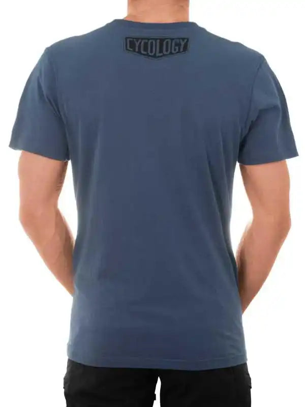 Men's blue cycling t-shirt with Cycology logo on back, casual fit for active wear