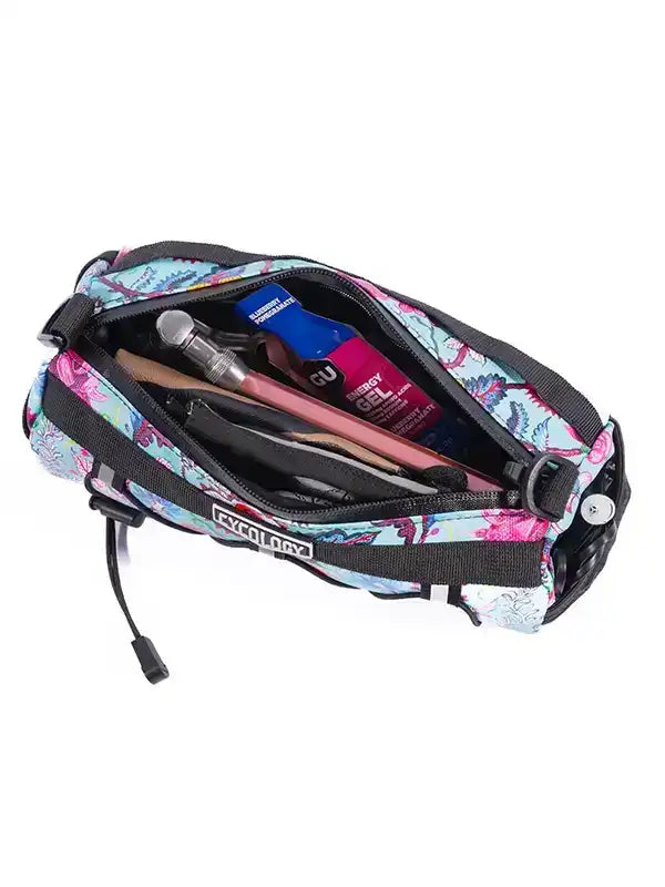 Cycling waist bag with floral print, holding energy gel, tools, and essentials for bike rides