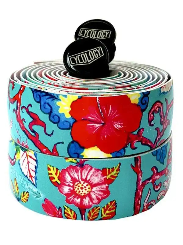 Colorful floral bike handlebar tape with Cycology logo caps, vibrant tropical design for cycling gear