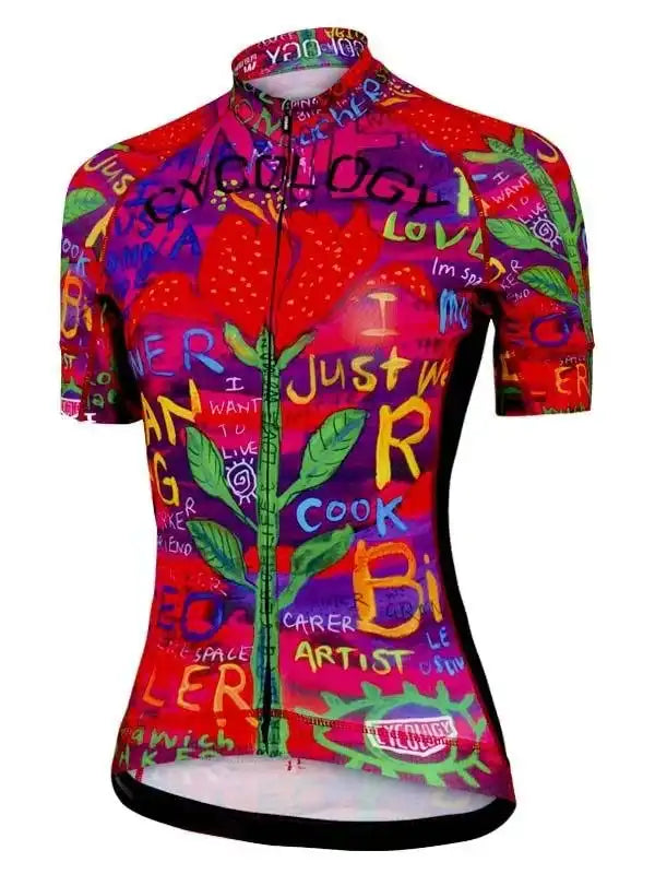 Women's vibrant cycling jersey with colorful graffiti art, strawberries, and bold text design for road biking