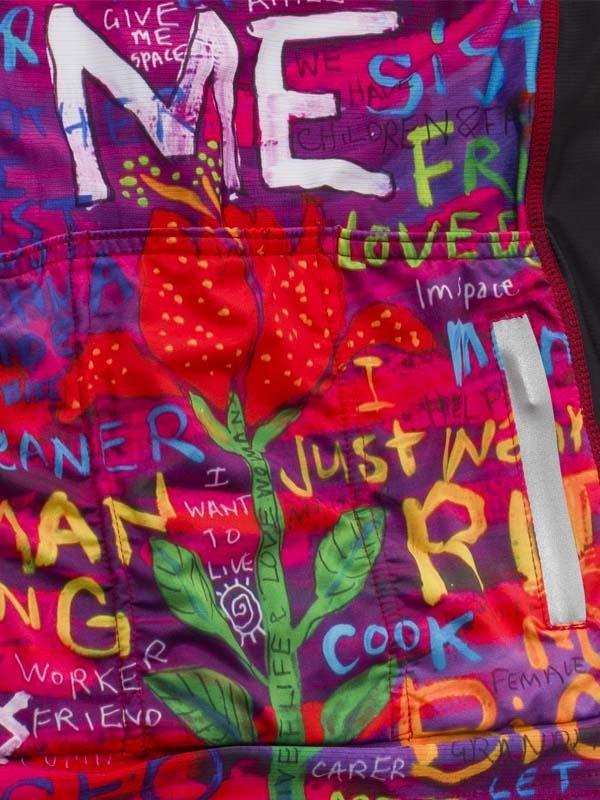 Vibrant cycling jersey with bold graffiti-style text and red flower design, perfect for women's cycling apparel.