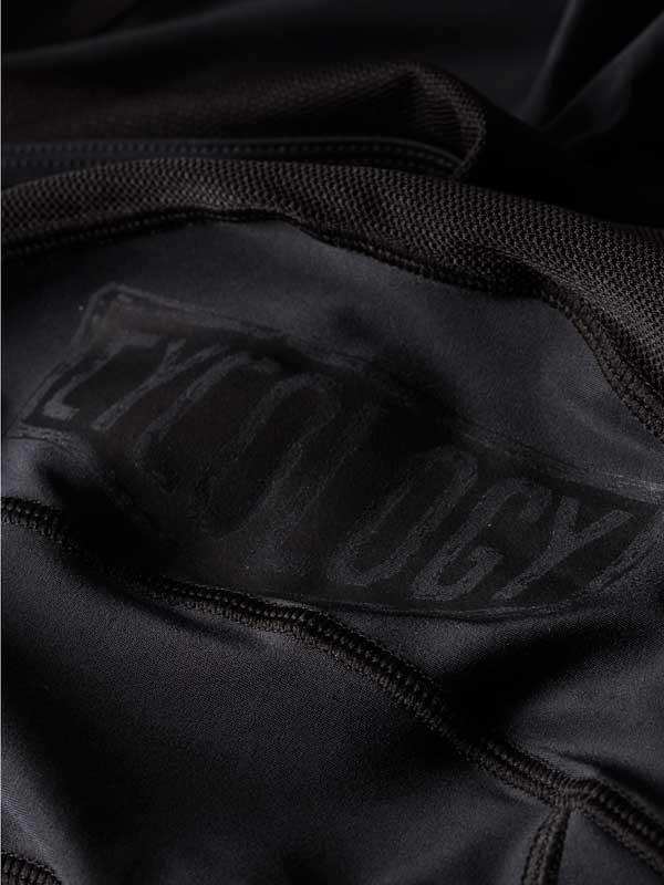 Black cycling jersey with subtle brand logo, high-quality fabric detail for men's and women's rides