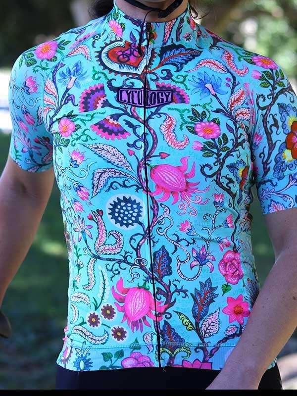 Vibrant floral cycling jersey with bold pink and blue patterns, perfect for men's and women's bike rides.