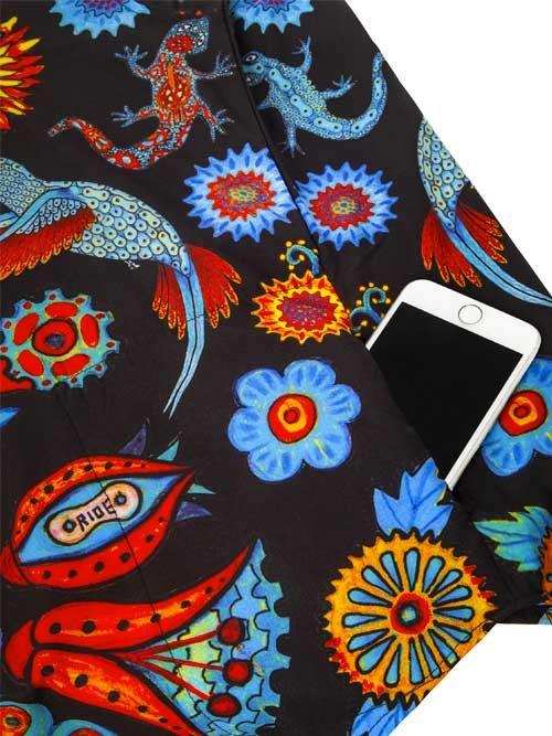 Vibrant lizard and floral print cycling shorts with phone pocket, bold colors, unique design